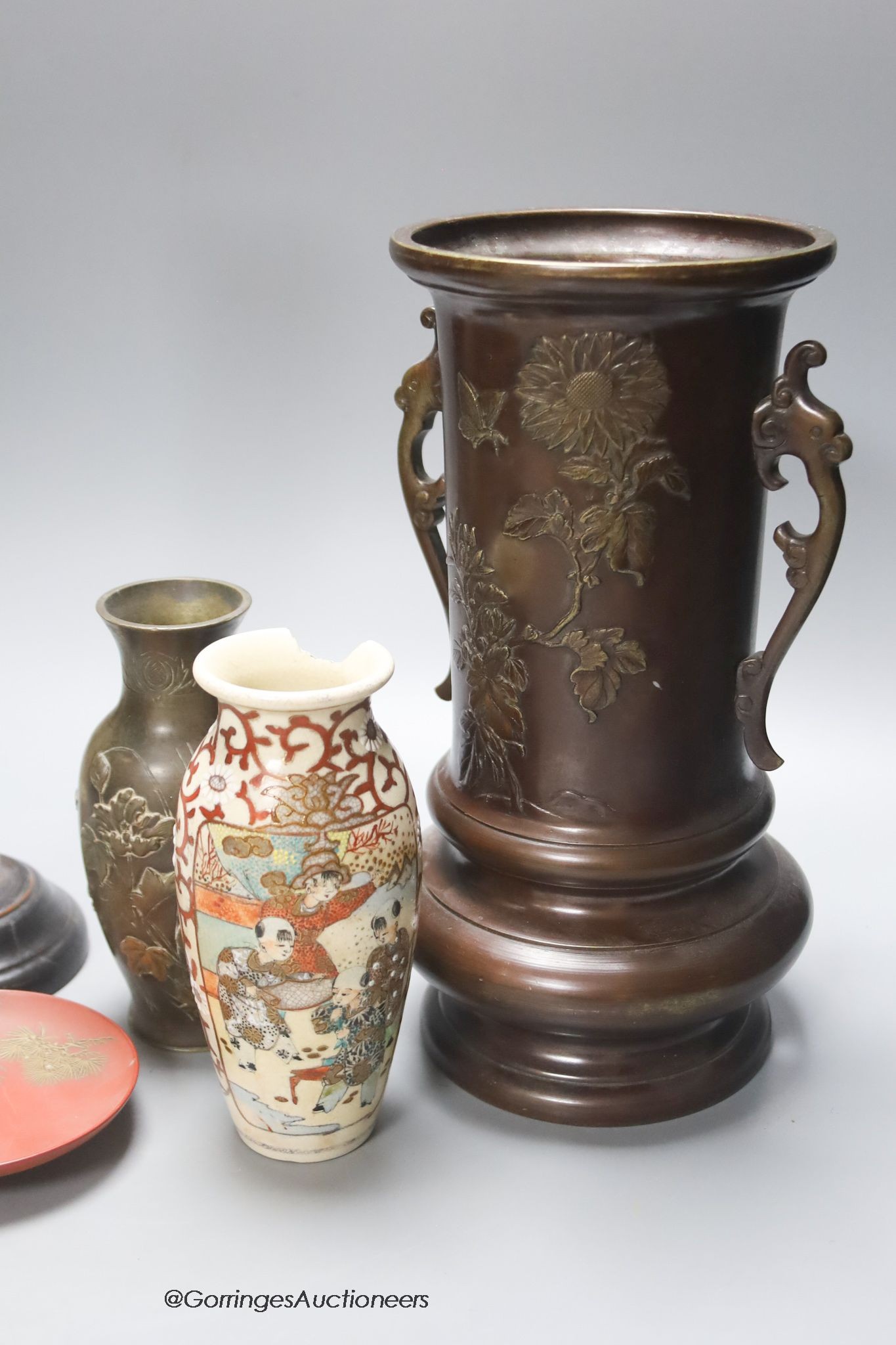 Various Japanese collectables including two bronze vases, a carving, a porcelain vase and a lacquer dish, tallest 27cm